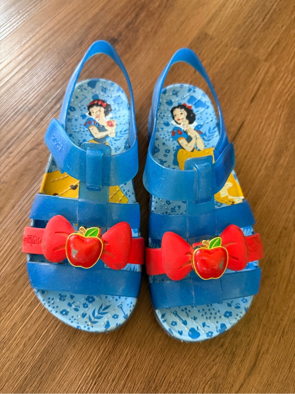 CROCS Blue Jelly Sandals with Red Bow and Apple Charm